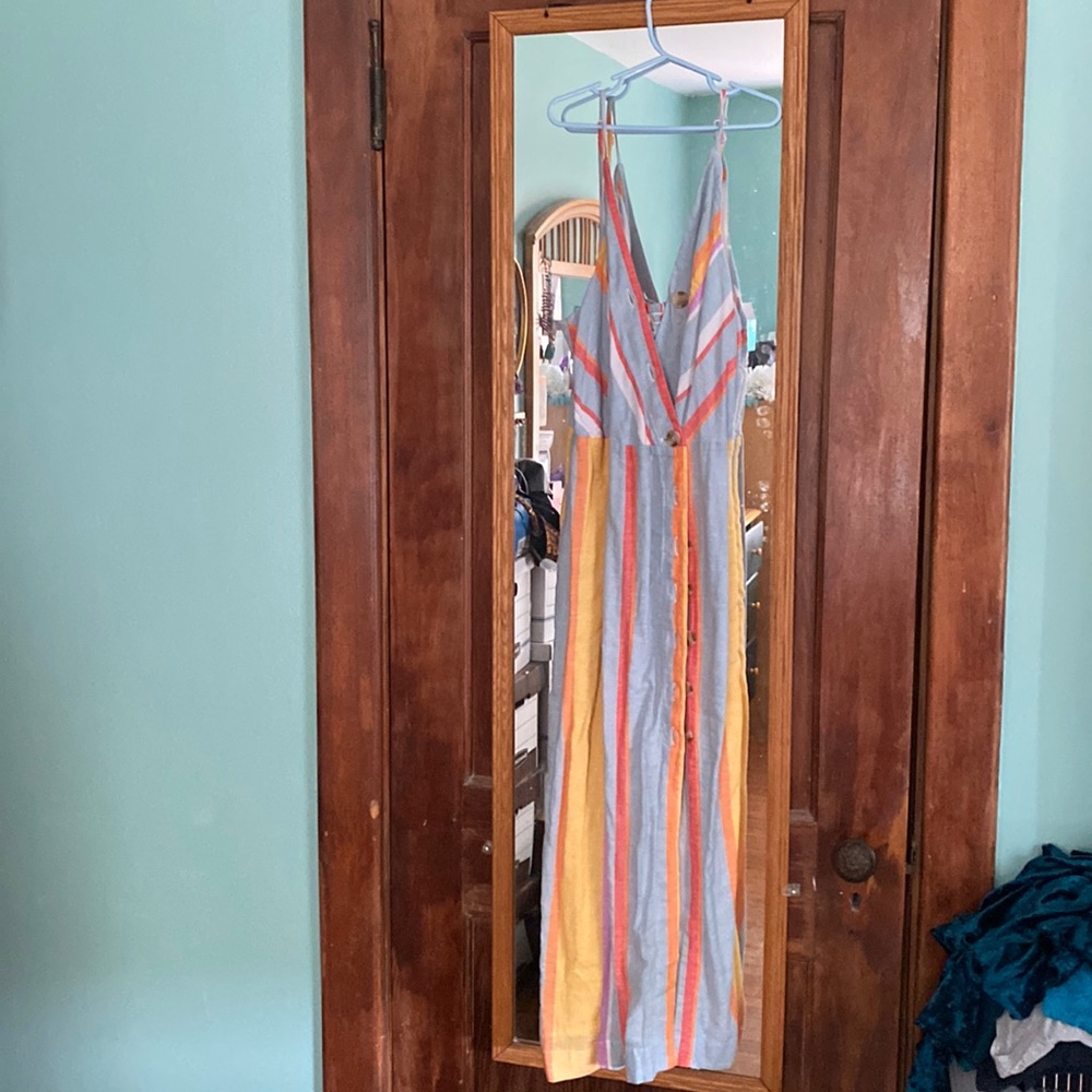 Multicolored, spaghetti strap dress with buttons down front. Never been worn.